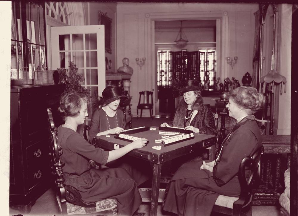 Four women playing mahjong at home, 1922